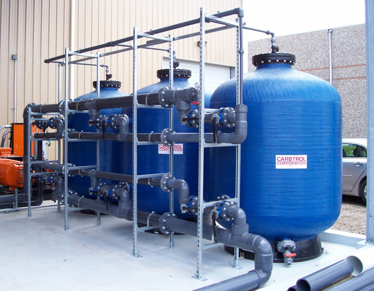 High-capacity carbon filtration vessels for whole-property water treatment